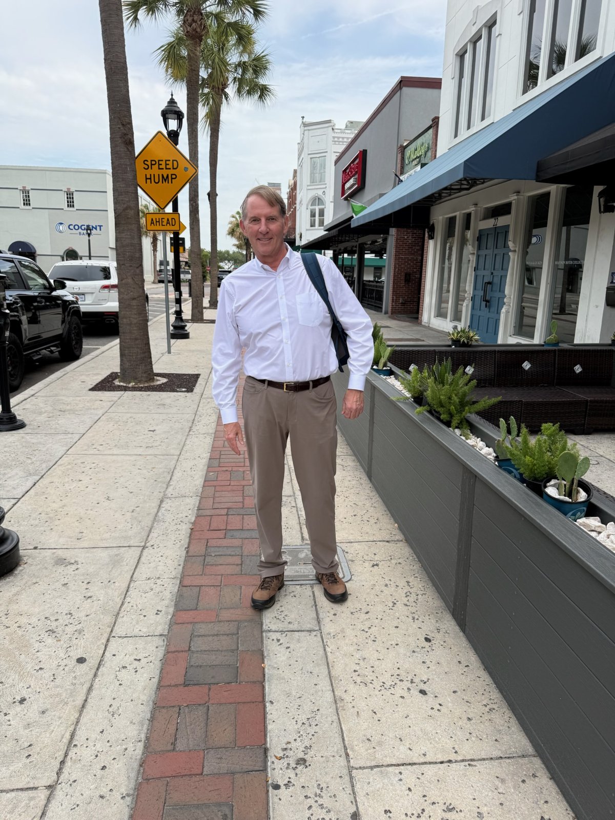 Steve Morgan walking a downtown district